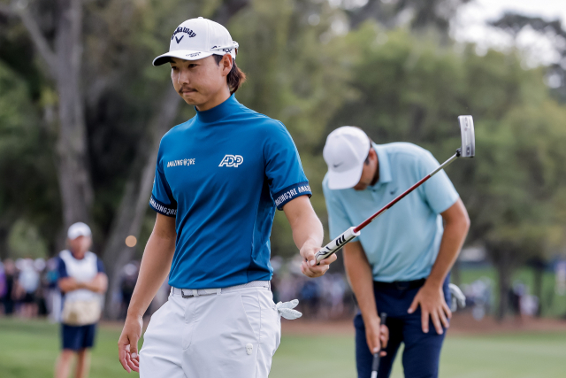 플레이어스 챔피언십에서 PGA 투어 첫 승을 노렸던 호주 교포 이민우(24)가 최종일 18번 홀에서 퍼팅을 마친 후 아쉬운 표정을 짓고 있다. EPA연합뉴스