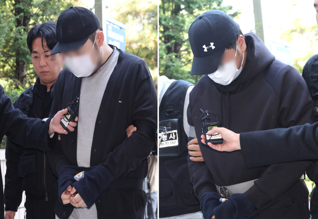 인천 아파트 지하 주차장에서 유명 유튜버를 납치하고 살해하려 한 남성 2명이 29일 인천 미추홀구 인천지방법원에서 열린 구속 전 피의자 심문(영장실질심사)에 출석하고 있다. 연합뉴스